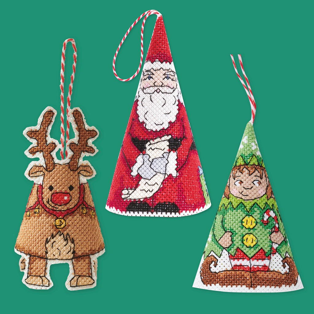 Three Christmas-themed needlepoint ornaments on a green background