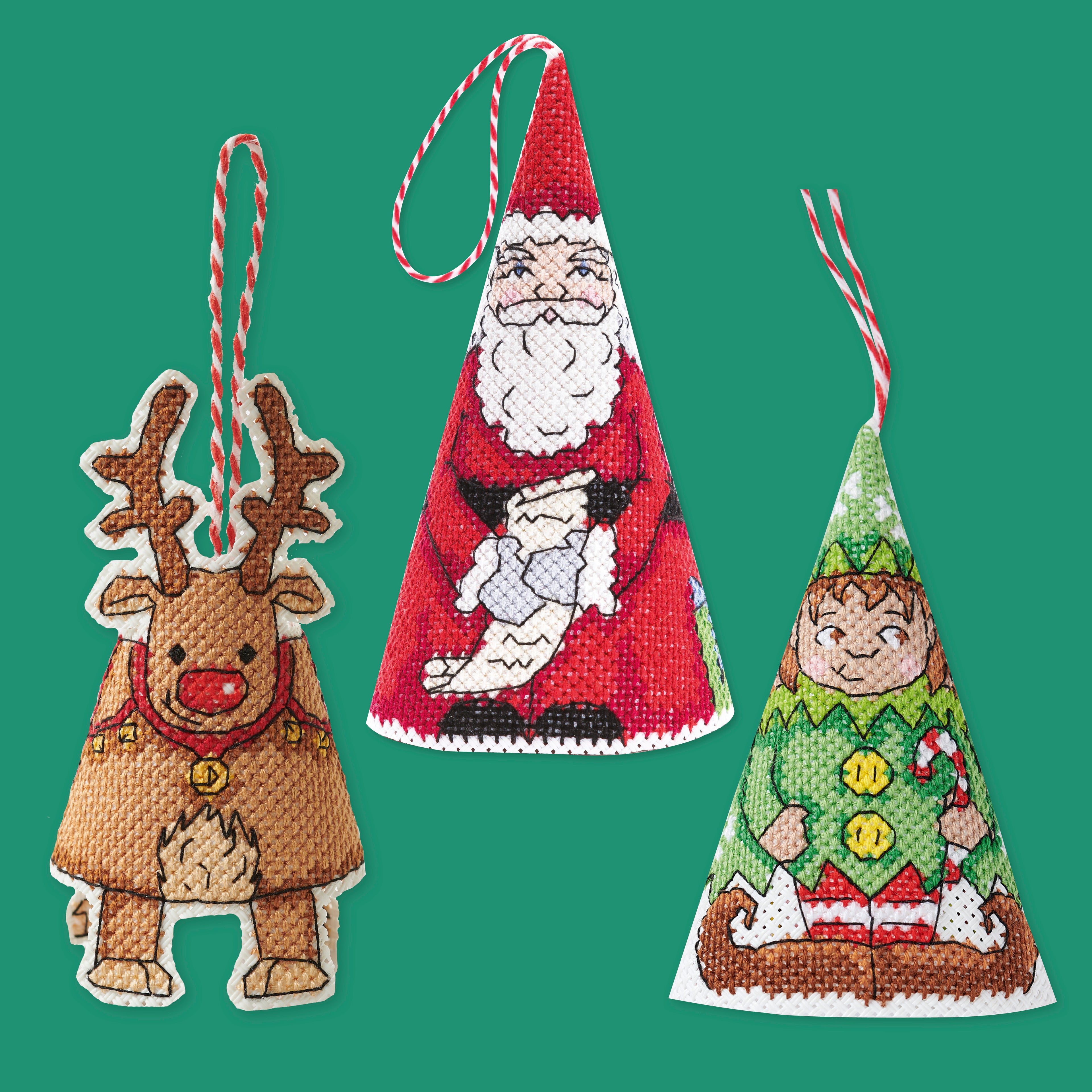 Three Christmas-themed needlepoint ornaments on a green background
