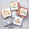 Set of greeting cards with duck illustrations on a textured surface