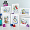 Collection of cross-stitched cards featuring animals and festive elements on a white background.