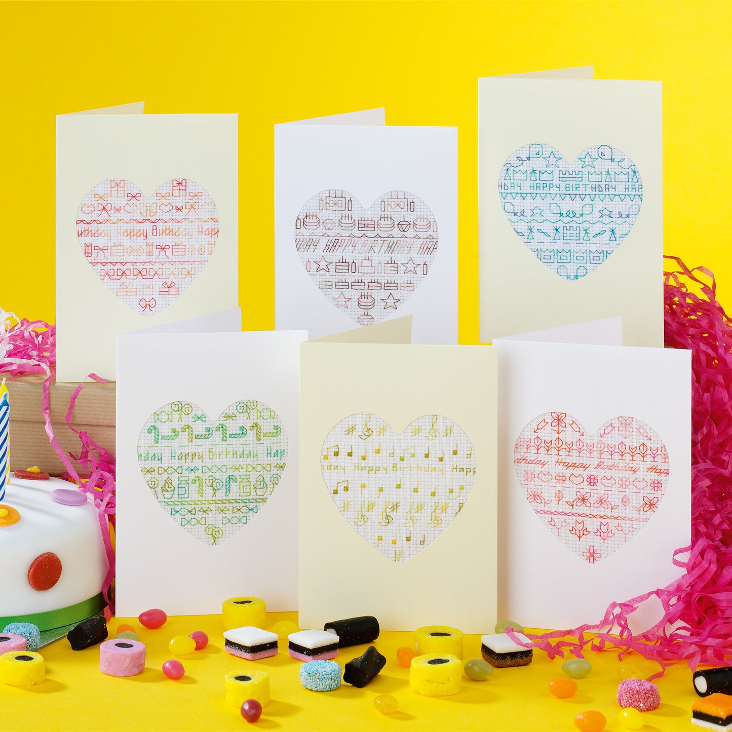 Set of greeting cards with heart designs on a yellow background