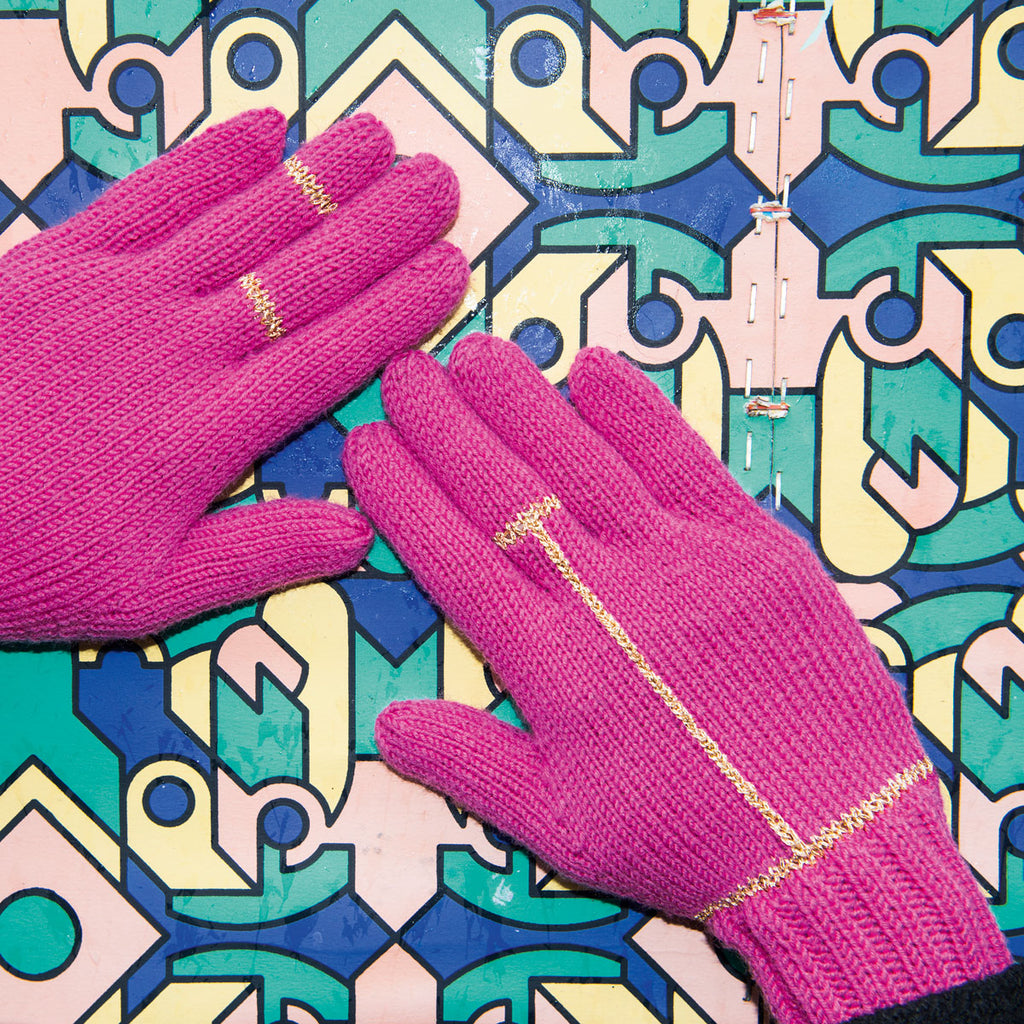 pink knitted gloves with gold details