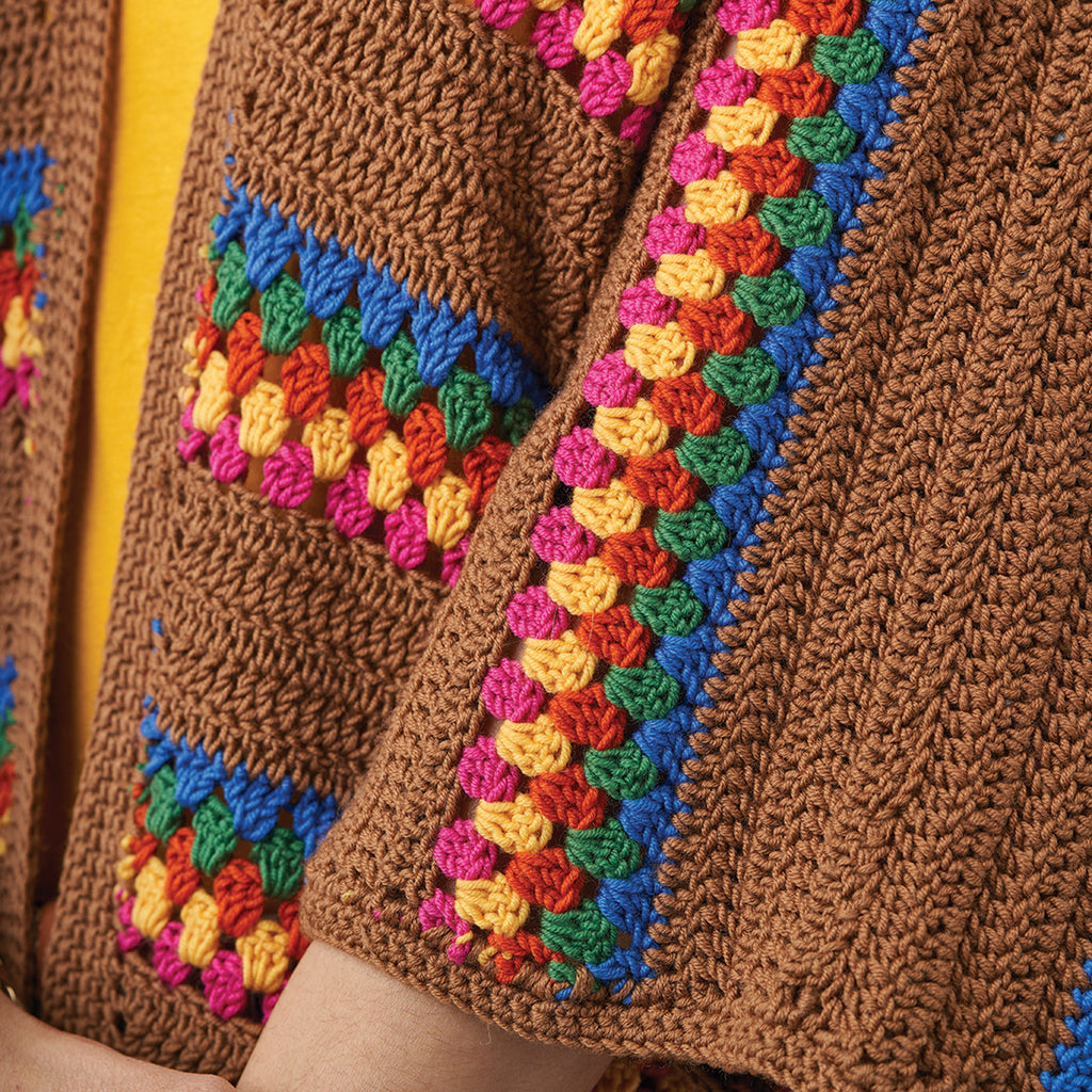Close-up of a brown knitted garment with colorful边缘