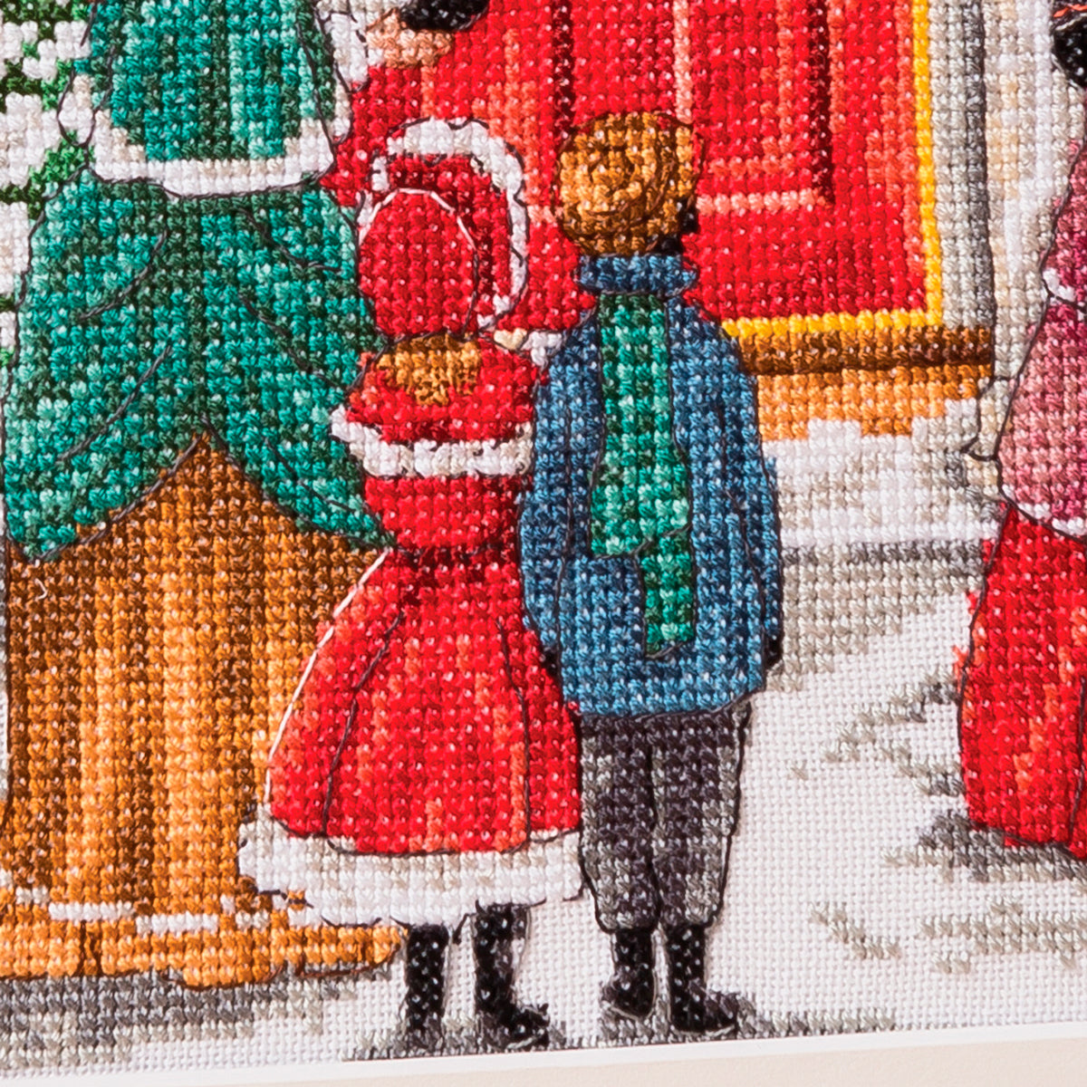 Cross-stitched scene with people in winter clothing near a building