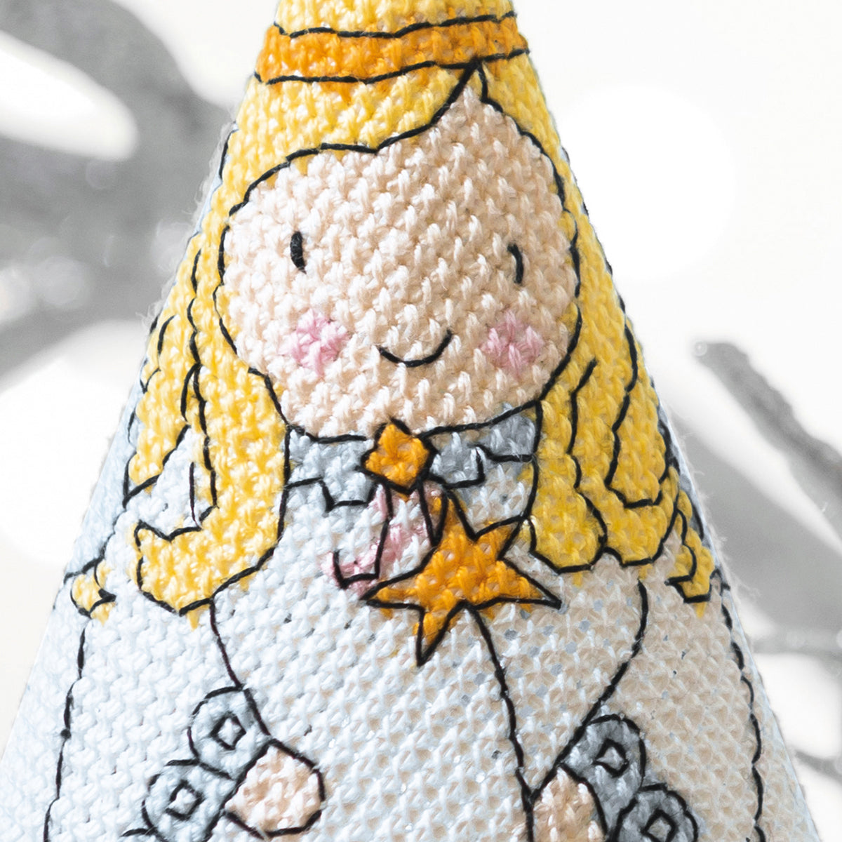 Cross stitch angel design on a white background