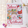 Cross-stitched panel with Santa Claus and Christmas-themed designs on a white background.
