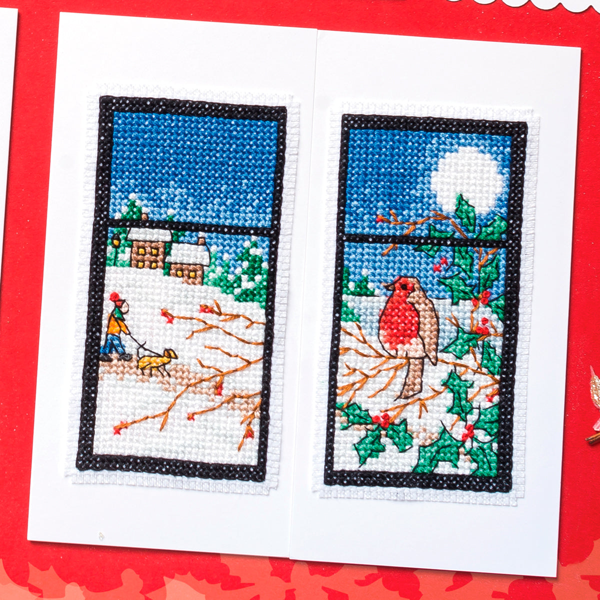 Cross-stitched scene with a bird and person by a window on a red background