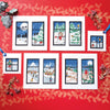 Set of cross-stitch patterns depicting winter scenes on a red background with decorative elements.