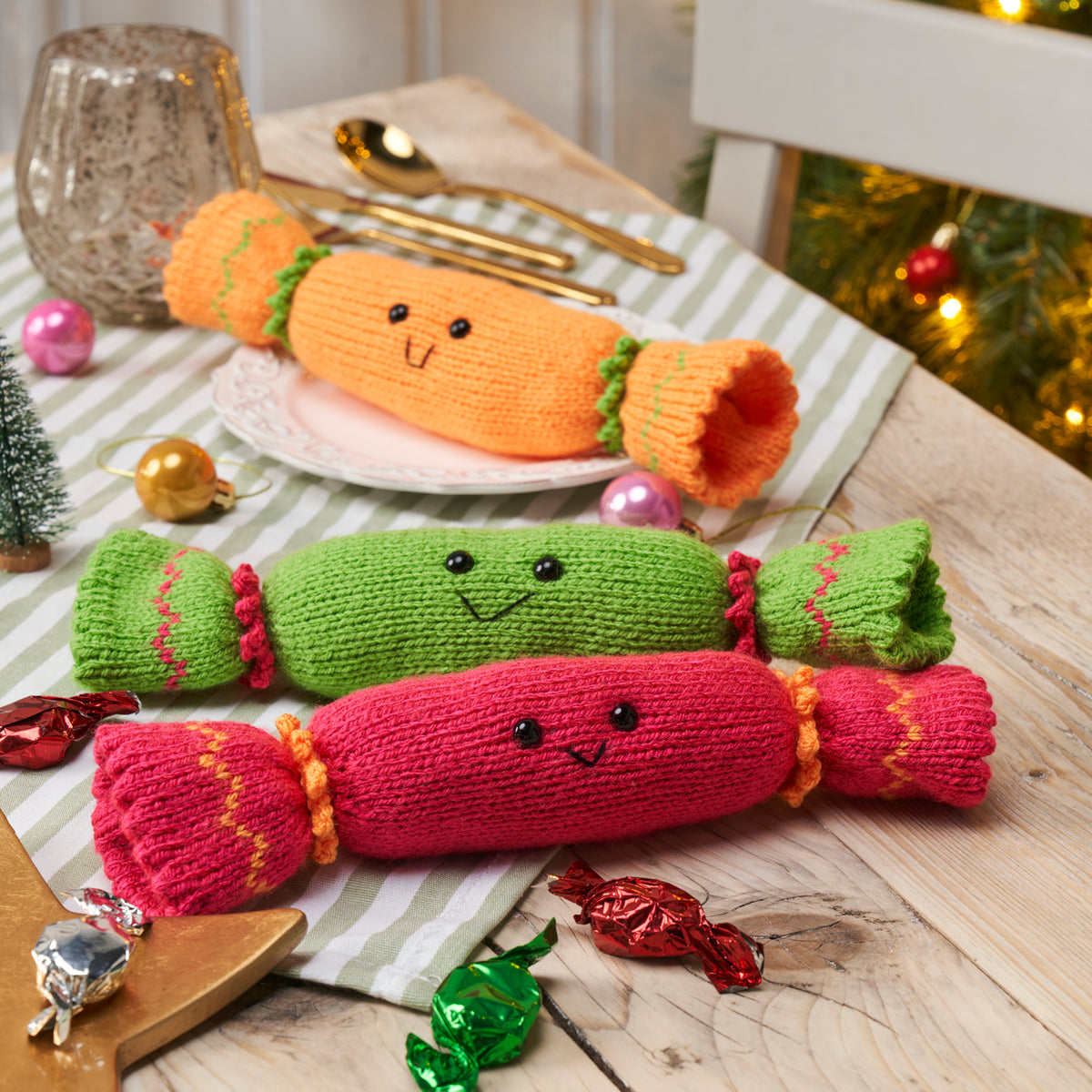Christmas cracker knitting pattern on a festive table.