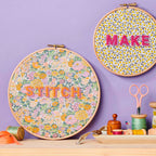 two embroidered hoops with the words 'stitch' and 'make'