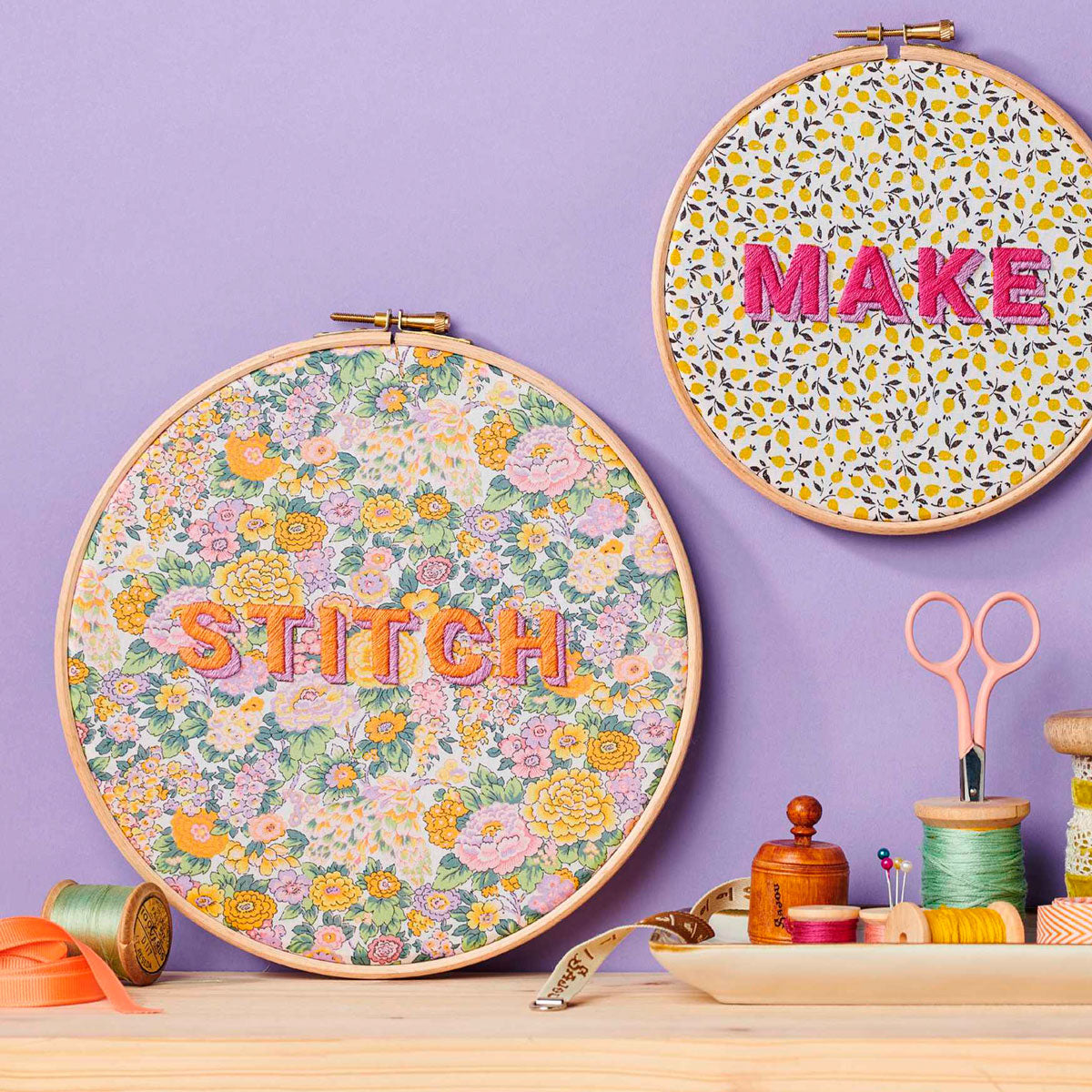 two embroidered hoops with the words 'stitch' and 'make'