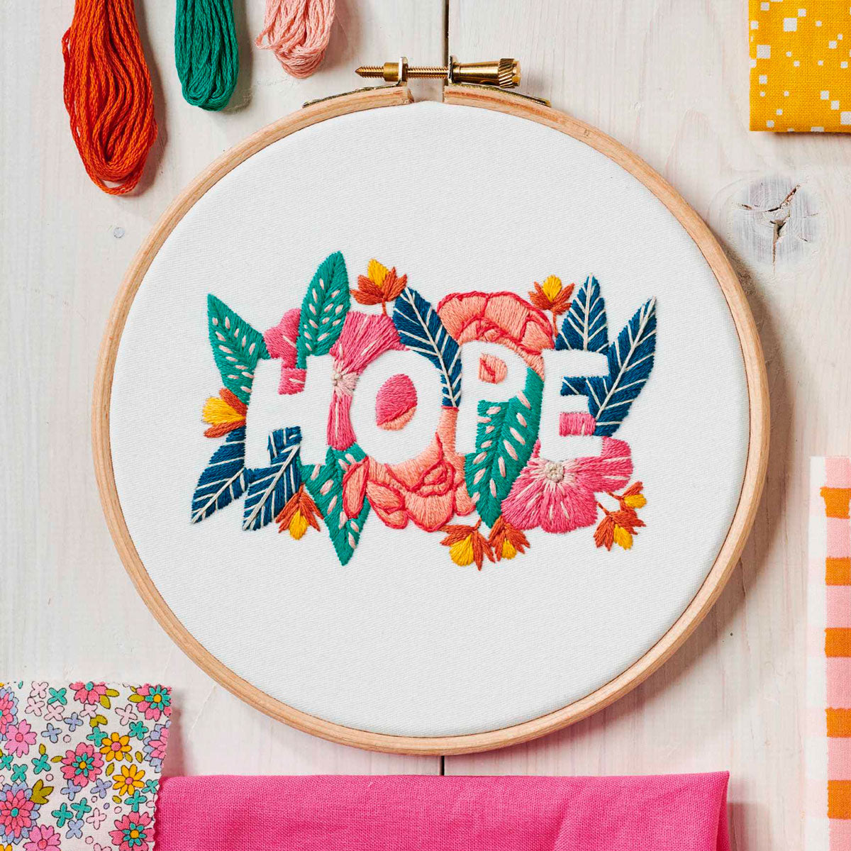 An embroidered hoop with the word 'hope'