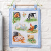 Cross-stitched panel with farm animals on a white background