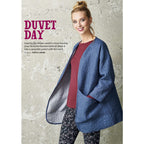 A woman smiles, wearing a blue quilted jacket over a maroon top and floral pants. Text reads "Duvet Day" with style tips. Background: textured wall.
