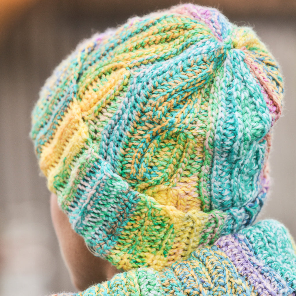 Close-up of a colorful crochet hat with a blurred background