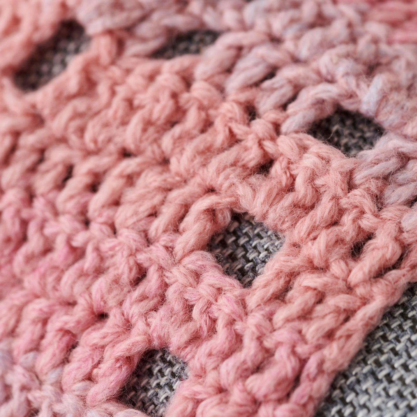 Close-up of pink and gray crocheted fabric