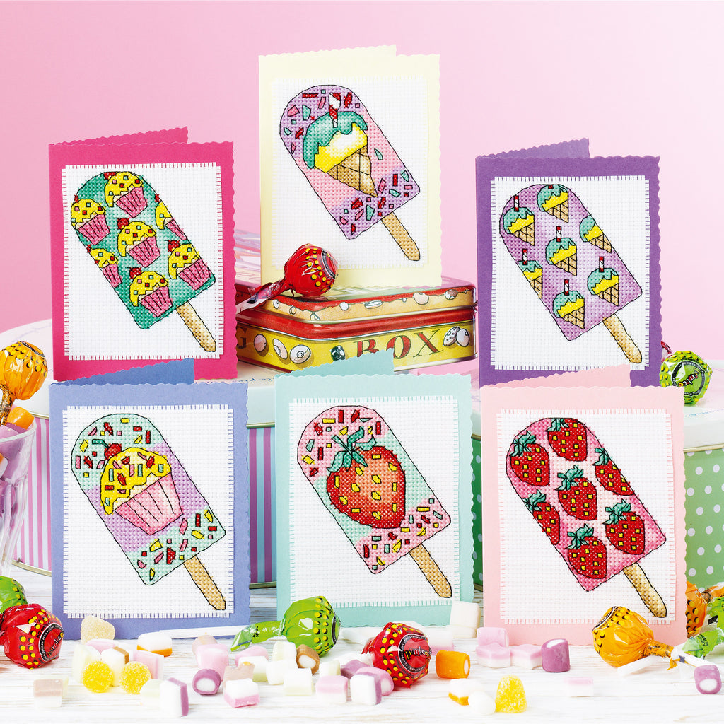 Cross-stitch pattern cards with colorful ice cream designs on a pink background