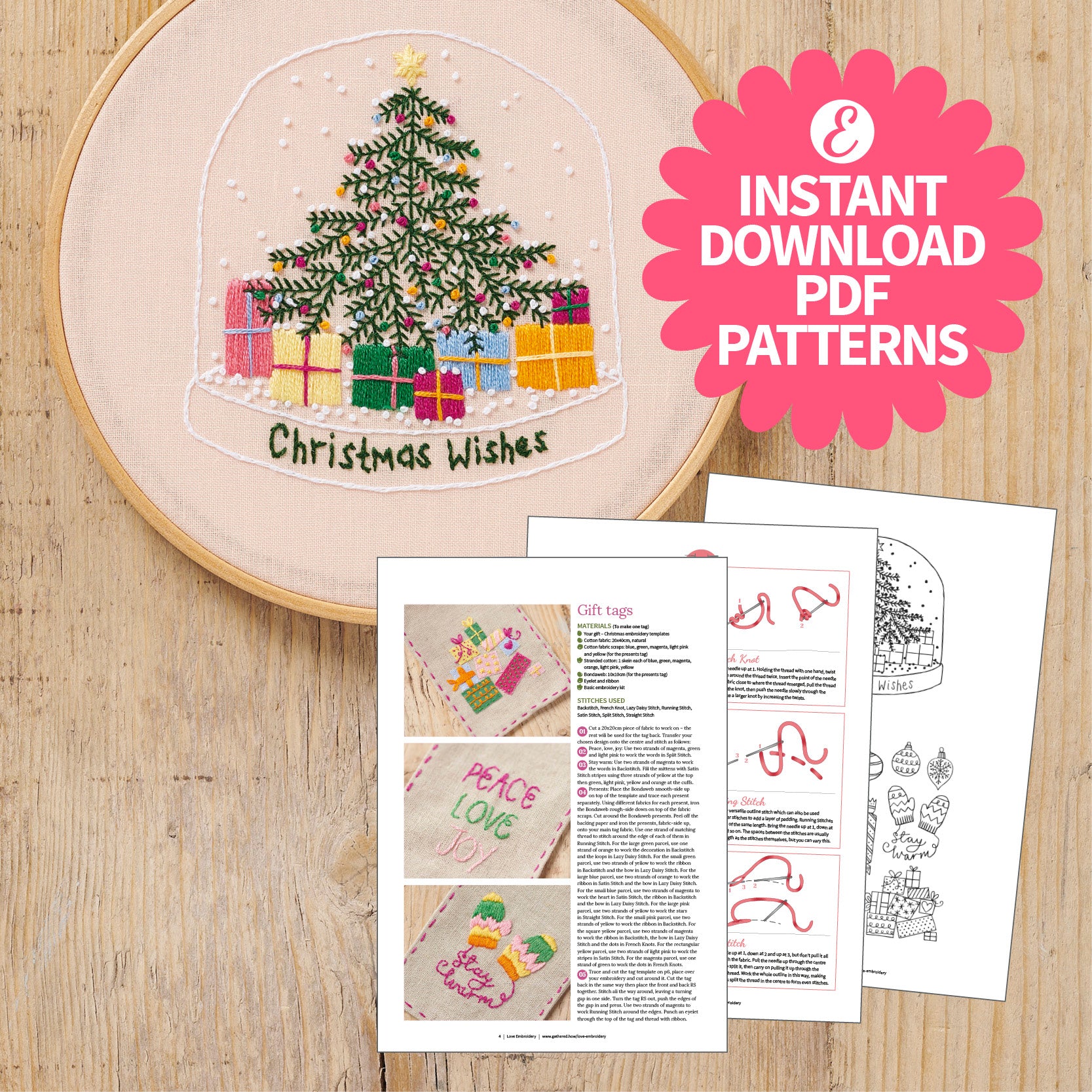 Embroidery hoop with Christmas tree design and PDF patterns on a wooden surface