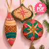 Decorative Christmas ornaments with star designs on a pink background, featuring a PDF pattern label.