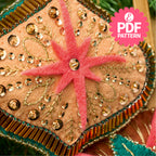 Decorative star with pink center and gold embellishments on a textured surface, with 'PDF Pattern' text overlay.