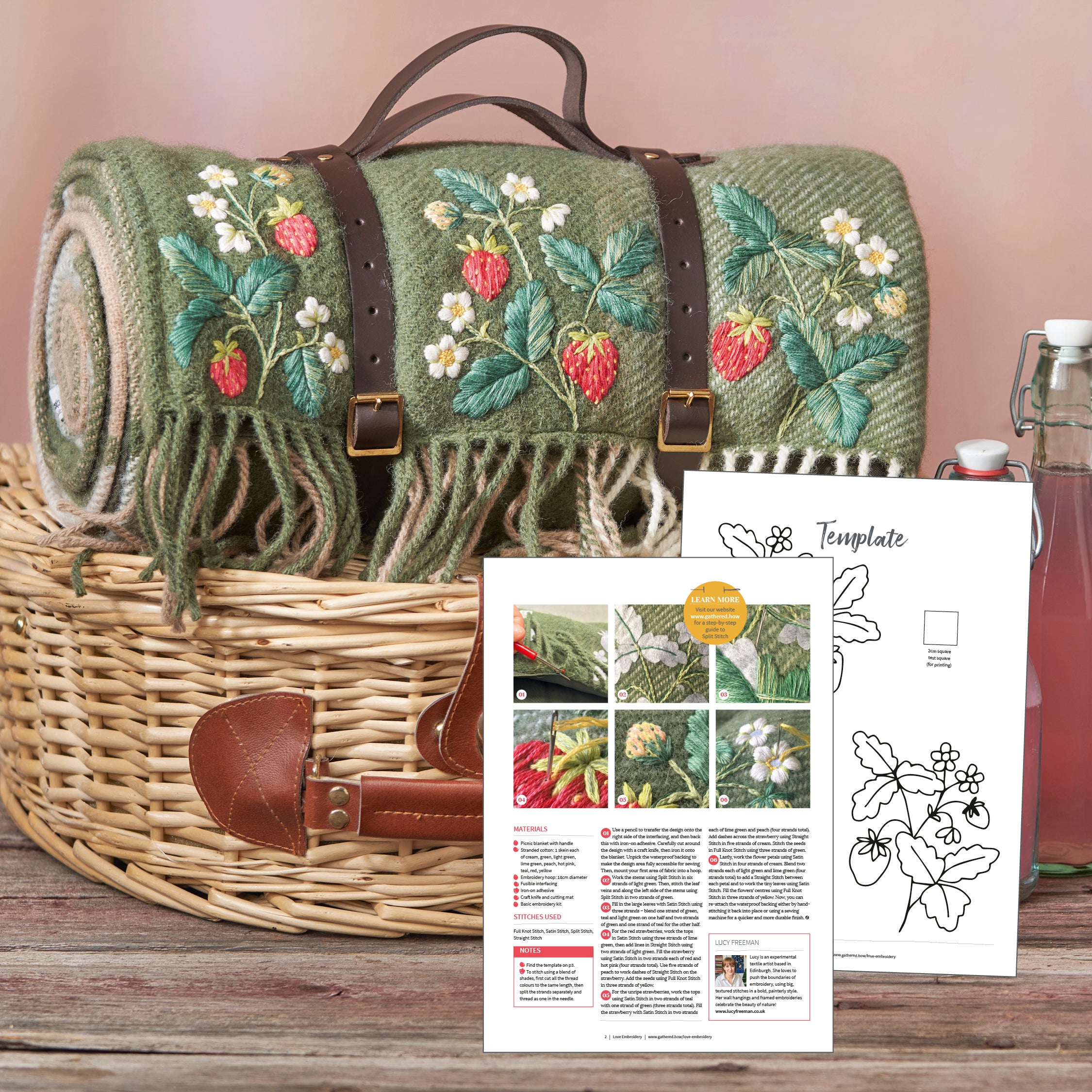 Embroidered roll-up mat with strawberry design in a wicker basket, accompanied by a pattern sheet.