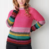 Smiling individual wearing a vibrant, multicolored striped sweater with a pink top section; set against a white, paneled background.
