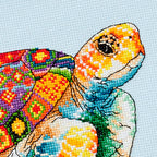 Colorful turtle cross-stitch pattern on a light blue background
