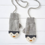 a pair of knitting mittens with a penguin design