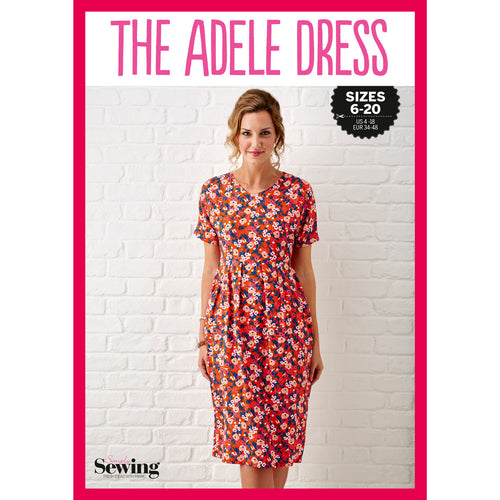 Woman wearing a bright floral dress stands against a white brick wall. "The Adele Dress" is printed above. Sizes 6-20 and a sewing logo are visible. Vibrant and cheerful mood.
