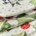 Stack of quilted fabric squares with Christmas patterns