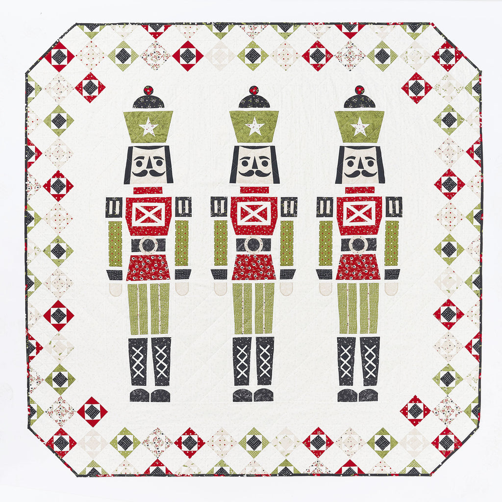 Quilt with nutcracker design on a white background