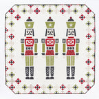 Quilt with nutcracker design on a white background