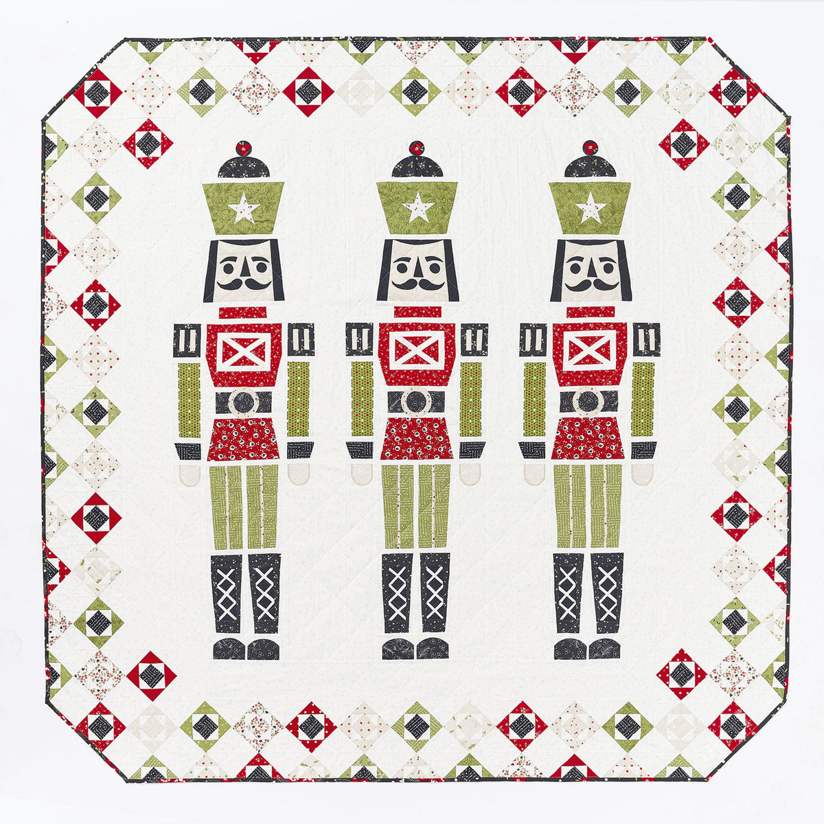 Quilt with nutcracker design on a white background