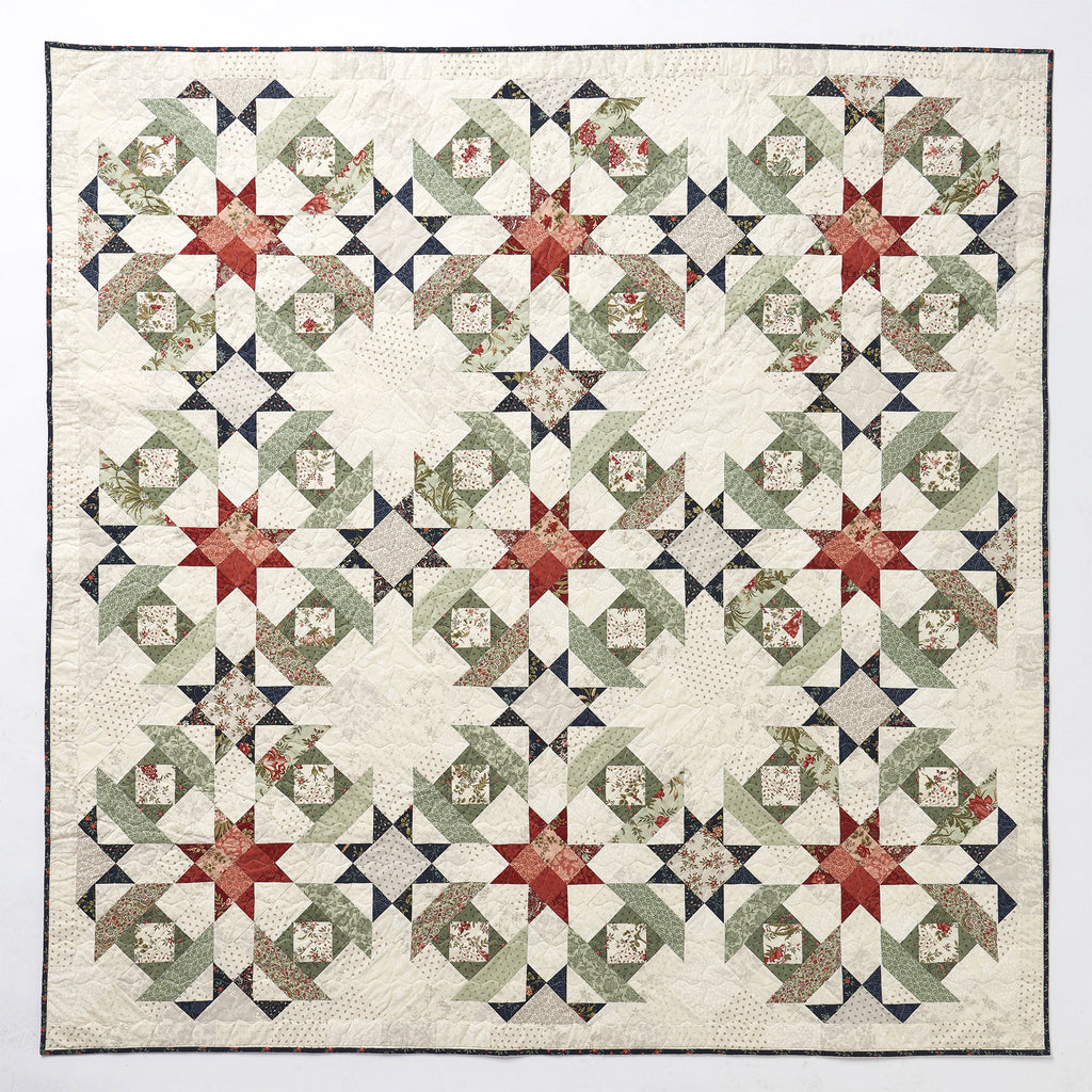 Quilt with star pattern on a white background