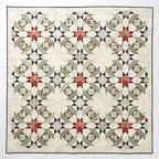 Quilt with star pattern on a white background