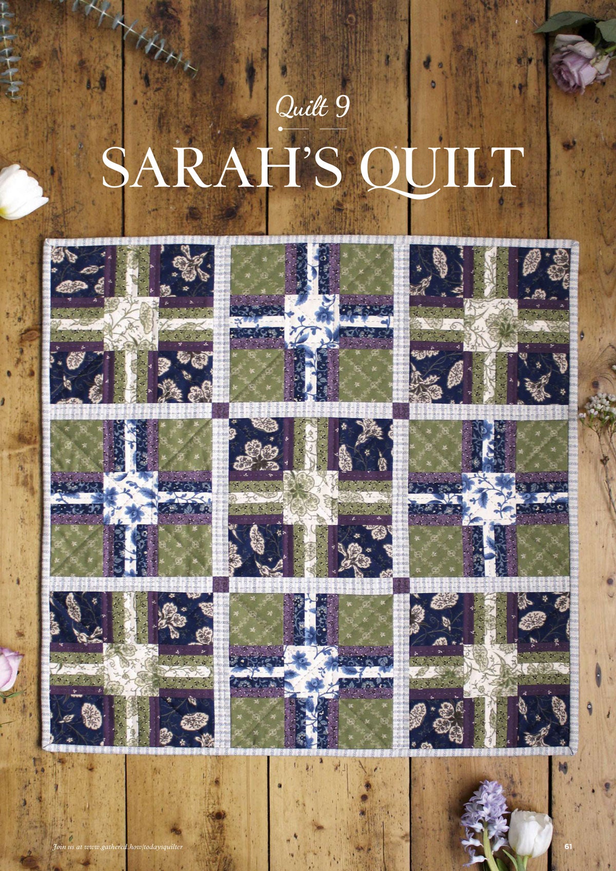 Quilt with intricate blue, green, and cream squares on a wooden floor. "Sarah's Quilt" text above. Rustic, cozy ambiance with scattered flowers.