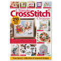 Magazine cover of 'Ultimate Cross Stitch Christmas' with festive designs and text.
