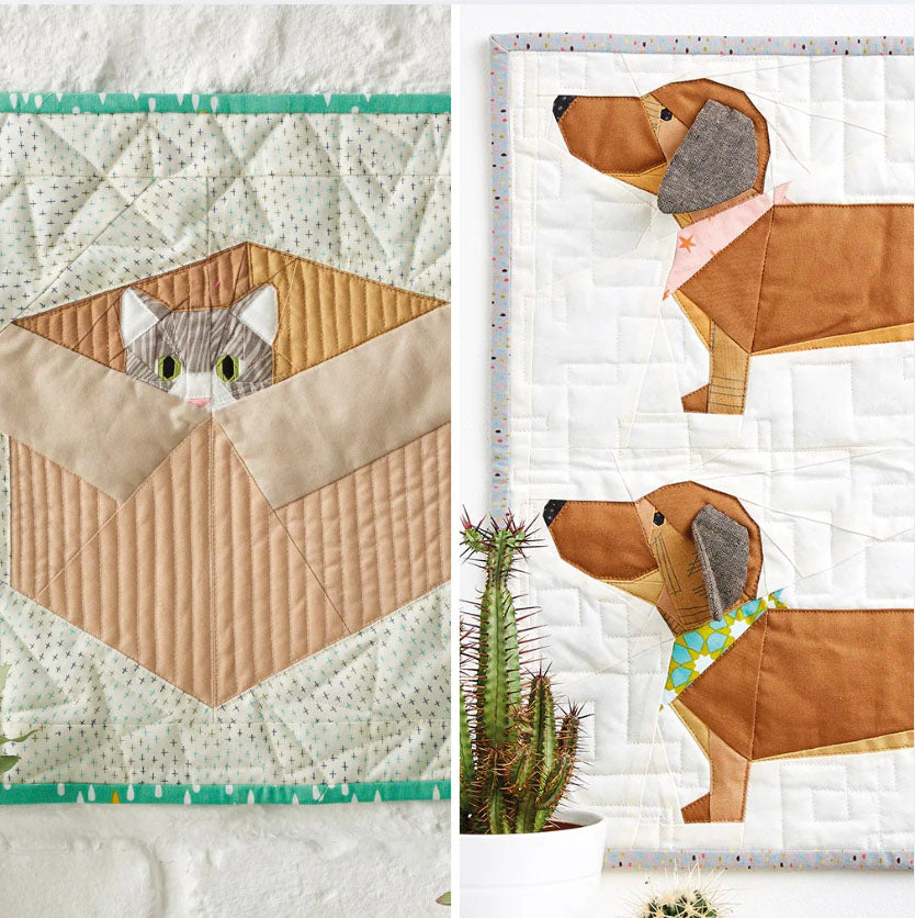 Two quilted panels featuring a cat and a dog design on a white background.