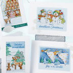 Collection of cross-stitched Christmas cards with festive designs on a white background.