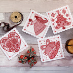 Decorative cards with red patterns on a wooden surface