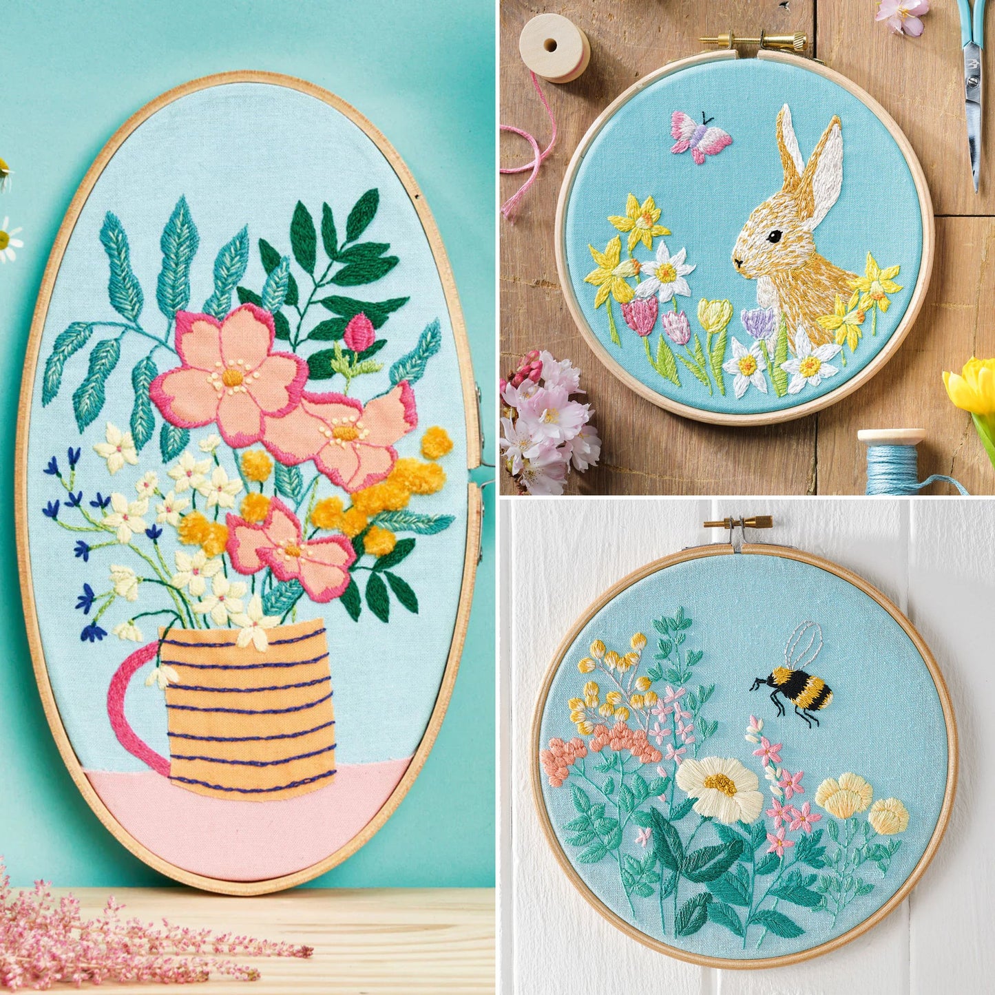 Three embroidered hoops with floral and nature-themed designs on a wooden surface.